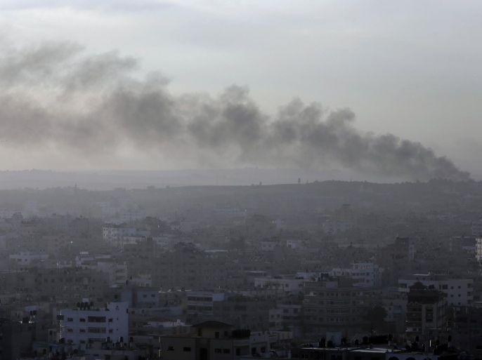 Amidst the morning fog, smoke from an Israeli strike rises over Gaza City, Saturday, July 26, 2014. Israel-Hamas fighting looked headed for escalation after U.S. Secretary of State John Kerry failed Friday to broker a weeklong truce as a first step toward a broader deal. Hours after the U.S.-led efforts stalled, the two sides agreed to a 12-hour humanitarian cease-fire to begin Saturday. However, the temporary lull was unlikely to change the trajectory of the current hostilities amid ominous signs that the Gaza war is spilling over into the West Bank. (AP Photo/Lefteris Pitarakis)
