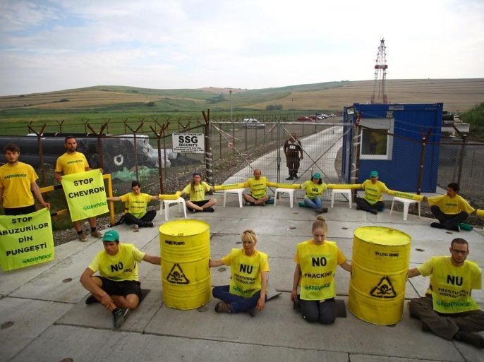 Greenpeace activists block the access to Chevron's shale gas exploration site in the village of Pungesti, some 350km north of Bucharest, Romania, 07 July 2014. 25 Greenpeace activists from seven countries chained themselves in front of US energy giant Chevron's exploration site, demanding the the stopping of the shale gas exploitation through hydraulic fracturing.
