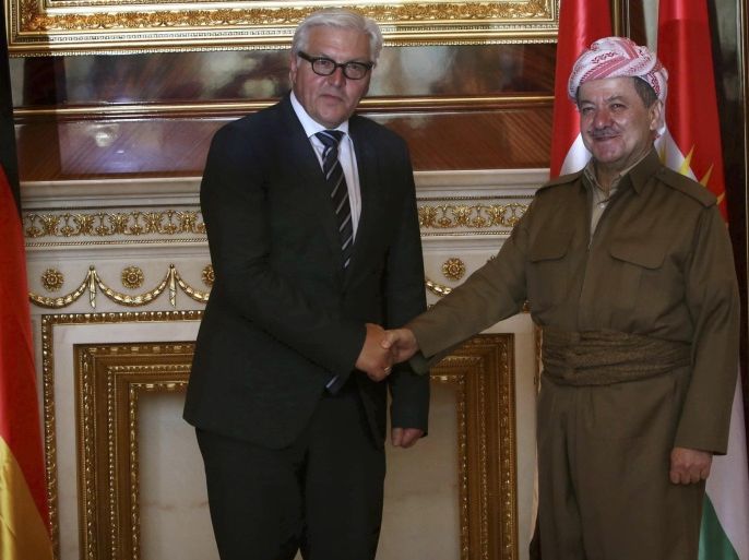 Iraqi Kurdistan President Masoud Barzani (R) shakes hands with Germany's Foreign Minister Frank-Walter Steinmeier in Arbil, north of Baghdad August 16, 2014. The leader of Iraq's Kurds appealed to Germany for weapons to help Kurdish fighters battling militants of the Islamic State, and said foreign powers must find a way to cut off the group's funding. REUTERS/Stringer (IRAQ - Tags: CIVIL UNREST POLITICS CONFLICT MILITARY)