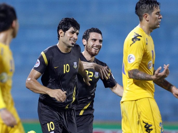 Arbil's Amjed Radhi (2-L) celebrate with his teammate Nadim Sabg (2-R) after a goal against Hanoi T&T during their AFC Cup quarter-final match at Hang Day stadium in Hanoi, Vietnam, 19 August 2014.