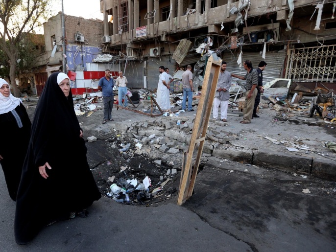 ‪آثار التفجير الذي وقع أمس الثلاثاء بمنطقة الكرادة ببغداد‬ (أسوشيتد برس)