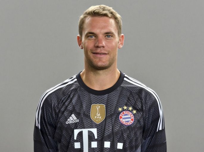 Bayern Munich's goalkeeper Manuel Neuer poses during the official team photocall of German first division Bundesliga football club FC Bayern Munich for the season 2014/2015 in Munich, southern Germany on August 9, 2014. AFP PHOTO / GUENTER SCHIFFMANN