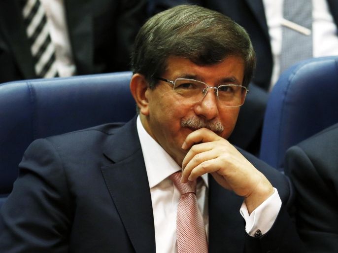 Turkey's Foreign Minister Ahmet Davutoglu attends a meeting at AK Party (AKP) headquarters in Ankara August 14, 2014. Turkish president-elect Tayyip Erdogan urged his ruling AK Party on Thursday to work for a stronger parliamentary majority next year to enable them to re-write the constitution, signalling no let-up in his drive to create an executive presidency. REUTERS/Umit Bektas (TURKEY - Tags: POLITICS)