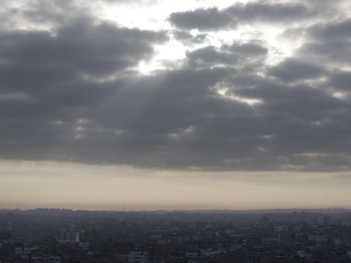 Clouds hover above Gaza City, Monday, Aug. 11, 2014. Israel and the Hamas militant group accepted an Egyptian cease-fire proposal Sunday, clearing the way for the resumption of talks on a long-term truce to end a month of heavy fighting in the Gaza Strip that has taken nearly 2,000 lives. (AP Photo/Lefteris Pitarakis)