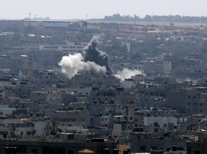 Smoke and dust rise after an Israeli strike hits in Gaza City, northern Gaza Strip, Tuesday, Aug. 26, 2014. The latest strikes came as Egypt urged Israel and Hamas to resume indirect talks on a permanent cease-fire, based on an Egyptian proposal for a new border deal for blockaded Gaza. (AP Photo/Adel Hana)