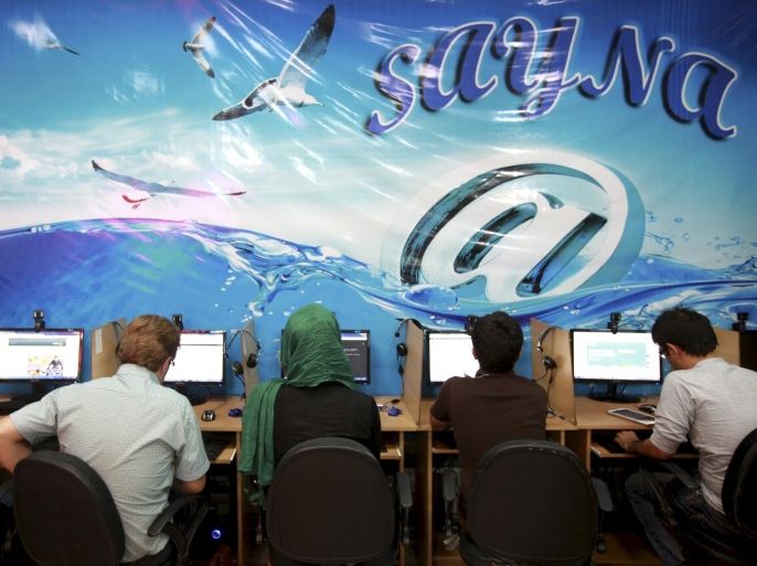 Iranians surf the Internet at a cafe in Tehran, Iran, Tuesday, Sept, 17, 2013. The joy of Iran's Facebook and Twitter fans was short-lived as authorities on Tuesday restored blocks on social networks after filters were lifted for several hours overnight. The brief access was a "technical glitch" that was quickly rectified, according to communications official Abdolsamad Khoramabadi, from the board overseeing Internet in Iran.(AP Photo/Ebrahim Noroozi)