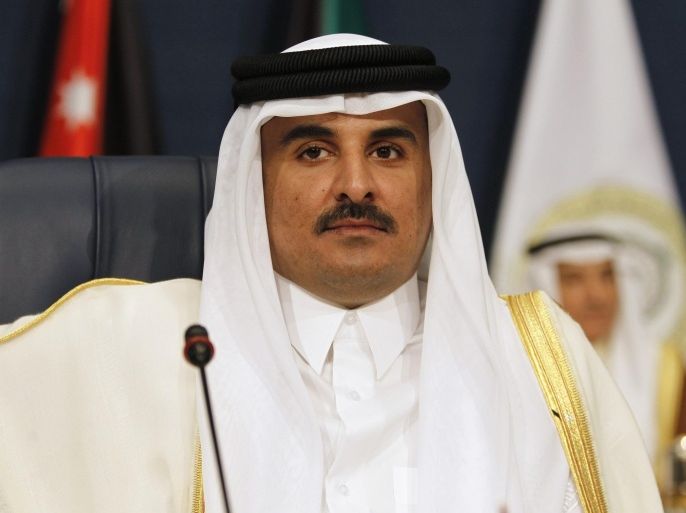 Emir of Qatar Sheikh Tamim bin Hamad al-Thani attends the 25th Arab Summit in Kuwait City, March 25, 2014. REUTERS/Hamad I Mohammed