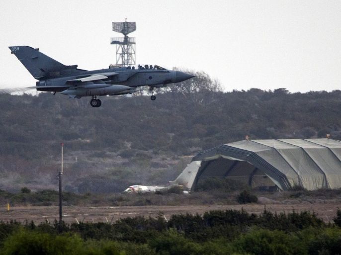 LIMASSOL, CYPRUS - SEPTEMBER 27: A British RAF tornado fighter jets prepares to land on an airstrip, as it passes by another Tornado next to a hanger, at RAF Akrotiri after returning from a mission over Iraq on September 27, 2014 in Limassol, Cyprus. The Commons voted by 524 to 43 on Friday to approve combat missions in Iraq in order to halt the advance of Isis militants.