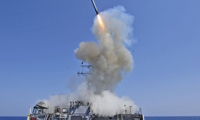 The guided-missile destroyer USS Barry launches a Tomahawk cruise missile from the ship's bow in the Mediterranean Sea in this U.S. Navy handout photo taken March 29, 2011. Barry is one of four U.S. destroyers currently deployed in the Mediterranean Sea equipped with long-range Tomahawk missles that could potentially be used to strike Syria, according to officials. REUTERS/Jonathan Sunderman/U.S. Navy/Handout/Files (ITALY - Tags: MILITARY POLITICS CIVIL UNREST) FOR EDITORIAL USE ONLY. NOT FOR SALE FOR MARKETING OR ADVERTISING CAMPAIGNS