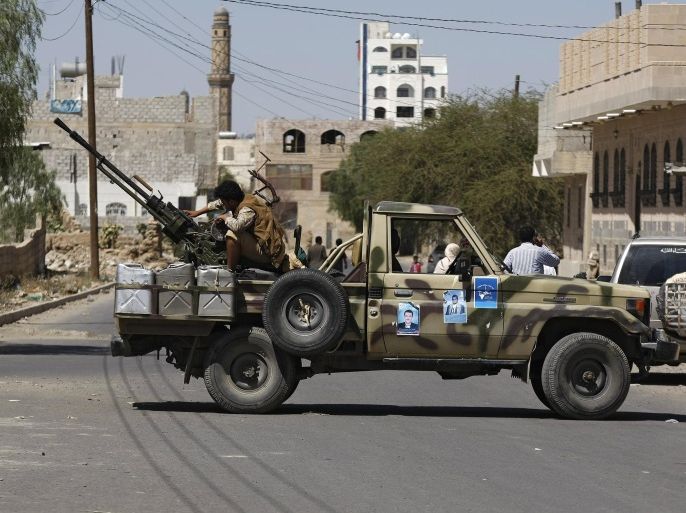 A Houthi Shiite rebel mans a machine gun mounted on a military truck in Sanaa, Yemen, Monday, Oct. 20, 2014. Yemeni security officials said al-Qaida’s Sunni militants seized al-Adeen town 200 kilometers (125 miles) south of the capital Sanaa in Ibb province. (AP Photo/Hani Mohammed)