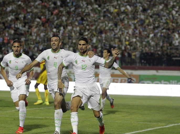 ALGIERS, ALGERIA - SEPTEMBER 10: Carl Medjani (12) of Algeria celebrates with his teammates after scoring a goal during the African Cup of Nations qualifiers group B soccer match between Algeria and Mali at Stade Mustapha Tchaker in Algiers, Algeria on September 10, 2014.