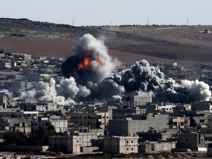 An explosion after an apparent US-led coalition airstrike on Kobane, Syria, as seen from the Turkish side of the border, near Suruc district, Sanliurfa, Turkey, 22 October 2014. Meanwhile, the Pentagon said it was possible that weapons delivered by the US military and meant for Kurdish fighters in Kobane, a Syrian Kurdish city near the Turkish border, may have inadvertently fallen into the hands of Islamic State (IS) militants.
