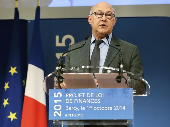 French Finance Minister Michel Sapin addresses reporters during the presentation of the 2015 budget, at the finance ministry in Paris, Wednesday Oct. 1, 2014. France’s Socialist government has detailed a euro21 billion ($26.5 billion) cost-cutting plan, the deepest-ever spending cuts in the country’s modern history. Presenting the 2015 budget, Finance Minister Michel Sapin said “These spending cuts are crucial to our credibility in the eyes of French and Europeans, they’ll be fully applied." (AP Photo/Remy de la Mauviniere)
