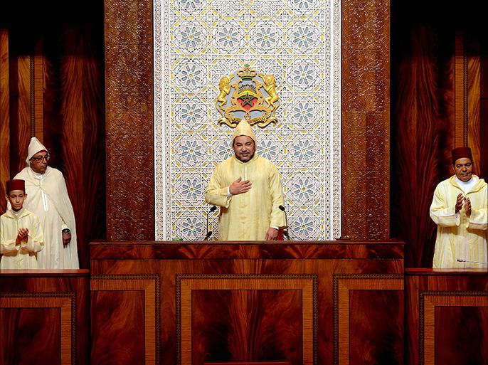 Morocco's King Mohammed VI (C) the Prince Moulay Rachid (R) and the Prince Hassan III (L) after the king delivered a speech before both houses of the parliament at the opening of the first session of the fourth legislative year of the 9th legislature. in Rabat on October 10, 2014
