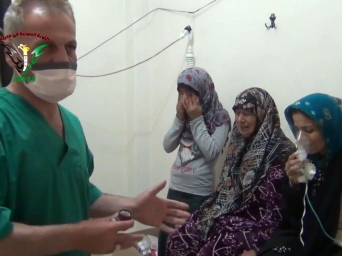 FILE - In this image taken from video obtained from the Shaam News Network, posted on April 18, 2014, an anti-Bashar Assad activist group, which has been authenticated based on its contents and other AP reporting, two women and a young girl are treated by a medic in Kfar Zeita, a rebel-held village in Hama province some 200 kilometers (125 miles) north of Damascus. A toxic chemical, almost certainly chlorine, was used "systematically and repeatedly" as a weapon in attacks on villages in northern Syria earlier this year, the global chemical weapons watchdog said Wednesday, Sept. 10, 2014. (AP Photo/Shaam News Network, File)
