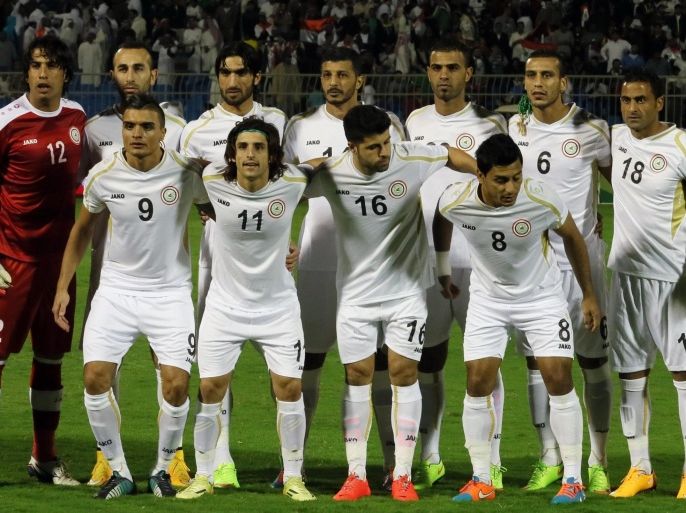 Iraq's starting eleven sing the national anthem ahead of their Gulf Cup football match against Kuwait at the Prince Faisal bin Fahad Stadium in Riyadh on November 14, 2014. AFP PHOTO/KARIM SAHIB