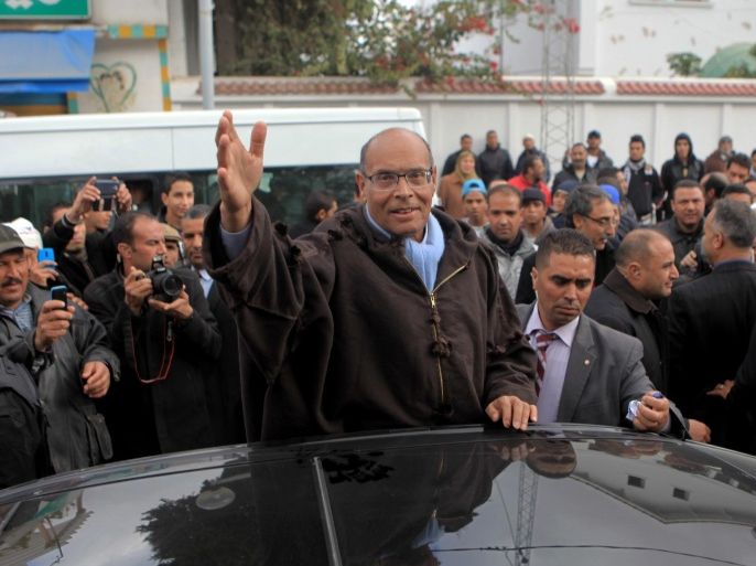 TUNIS, TUNISIA - DECEMBER 12: Tunisian presidential candidate Moncef Marzouki greets his fans as a part of his election campaign for the second round of presidential elections to be held on December 21, in Tunis, Tunisia on December 12, 2014.
