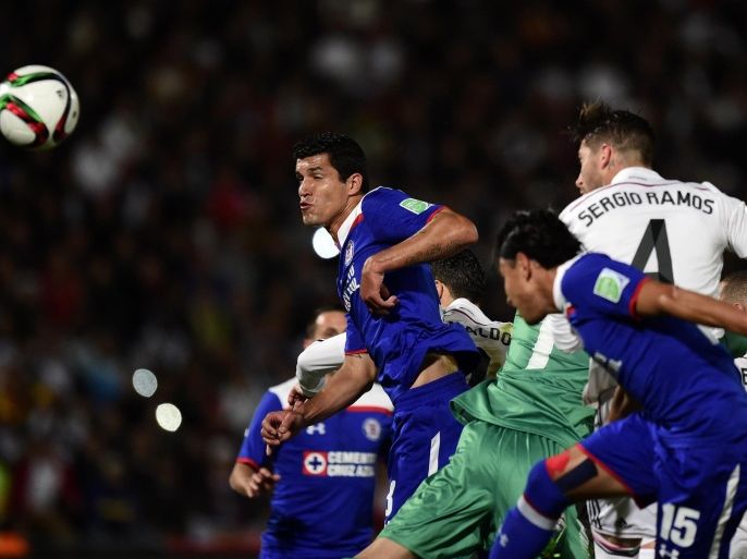 Real Madrid's defender Sergio Ramos (R) heads to score during the FIFA World Club Cup semi-final football match Real Madrid against Mexico's Cruz Azul FC at the Marrakesh Stadium on December 16, 2014 in Marrakesh. AFP PHOTO / JAVIER SORIANO