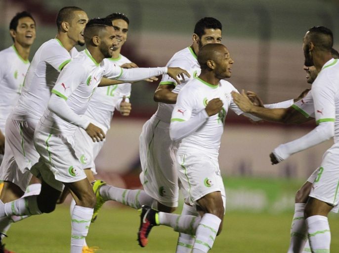Algeria's Yacine Brahimi (C) celebrates with team mates after scoring against Malawi during their African Nations Cup qualifying soccer match at Tchaker Stadium in Blida October 15, 2014. REUTERS/Louafi Larbi (ALGERIA - Tags :SPORT SOCCER)