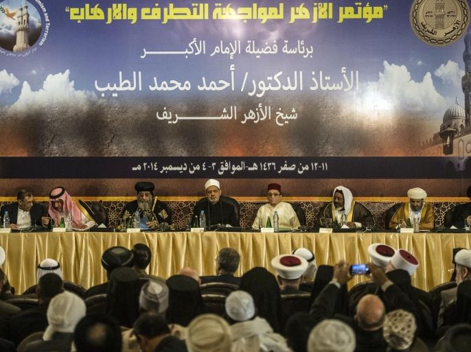 The Grand Imam of Al-Azhar, one of the most prestigious centres of Sunni Islam learning, Sheikh Ahmed al-Tayeb (5th R) and Coptic Pope Tawadros (3rd L) attend the opening session of a two-day international conference in Cairo on fighting extremism, on December 3, 2014. Sheikh Tayeb condemned 'barbaric crimes' committed by the Islamic State group in Iraq and Syria and called on the US-led coalition that is fighting IS 'to confront those countries who support terrorism financially and militarily'.AFP PHOTO / KHALED DESOUKI