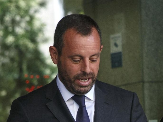 Former president of Barcelona soccer club Sandro Rosell leaves after being questioned at the High Court in Madrid July 22, 2014. The court is investigating alleged misappropriation of funds in last year's signing of Brazilian forward Neymar. REUTERS/Andrea Comas (SPAIN - Tags: SPORT SOCCER CRIME LAW)