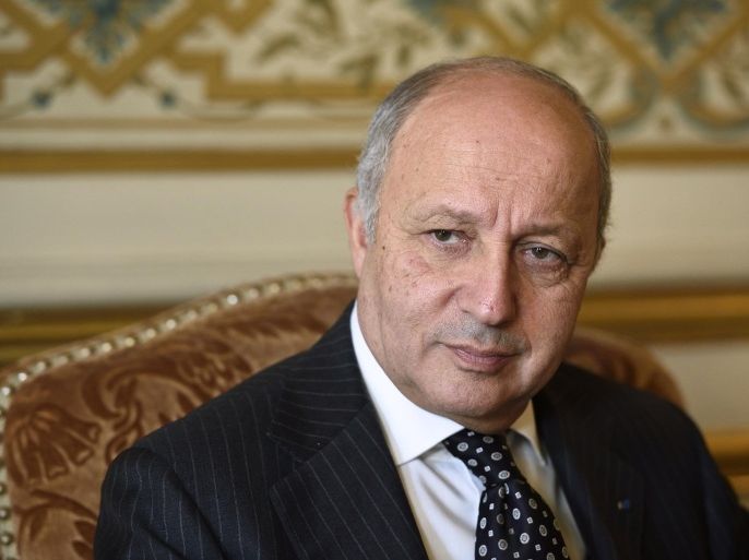 French Foreign Affairs minister Laurent Fabius poses in his office before a trip to Algeria on November 6, 2014 in Paris. AFP PHOTO / ERIC FEFERBERG