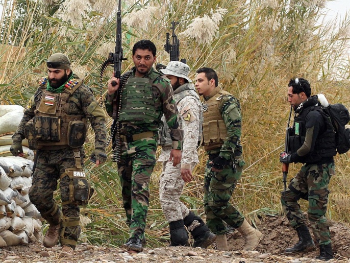 مقاتلون شيعة مساندون للجيش العراقي  بمحافظة صلاح الدين (غيتي)