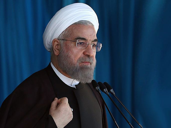 A handout picture released by the official website of the Iranian President Hassan Rouhani, shows him gesturing as he speaks to a crowd at a public meeting in the Gulf port city of Bushehr on January 13, 2015. President Hassan Rouhani said that Iran would withstand the economic pain of falling oil prices, suggesting Saudi Arabia would suffer more in the long run from the current slump AFP PHOTO/IRANIAN PRESIDENCY WEBSITE/MOHAMMAD BERNO/HO