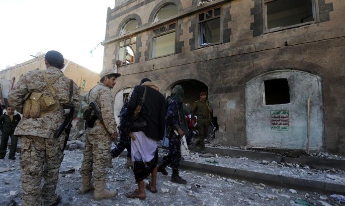Yemeni soldiers inspect the scene of a bomb blast targeting a base of the Shiite Houthi militia in Sana'a, Yemen, 05 January 2015. Reports state a large explosion targeted a base of the Shiite Houthi militia in Sana'a, wounding at least six people, one day after al-Qaeda militants attacked a guesthouse of the Shiite Houthi militias in south of Sana'a, killing six militiamen and wounding 31 others.