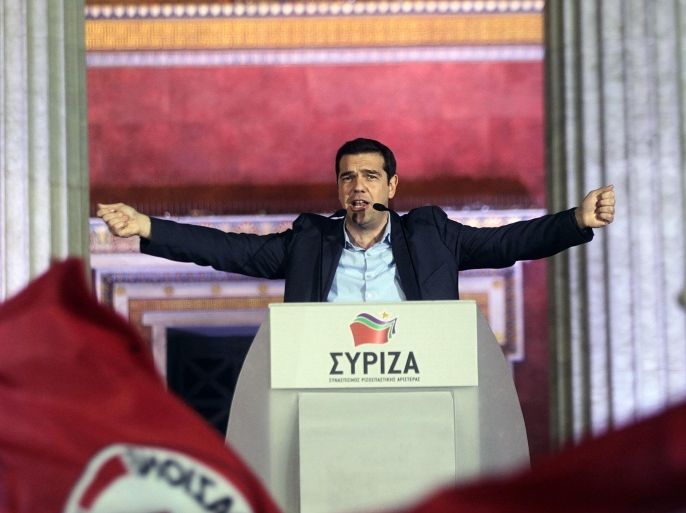 Alexis Tsipras, opposition leader and head of radical leftist Syriza party, greets supporters after the initial election results for the Greece general elections in Athens, Greece, 25 January 2015. Greeks revolted against five years of unrelenting austerity Sunday in a landmark vote that saw the leftist anti-bailout party SYRIZA place first in parliamentary elections. The opposition party was projected to earn around 35 per cent of the vote, falling short of an absolute majority in the 300-seat Parliament by one or two seats, the Interior Ministry said. Thousands of SYRIZA supporters flocked to the Athens University building, chanting and waving the party's red and white flags as party leader Alexis Tsipras addressed the crowd. 'The vote of the Greek people has closed the vicious circle of austerity,' he said, declaring Greece's 240-million-euro (270-million-dollar) bailout now 'a matter of the past.'