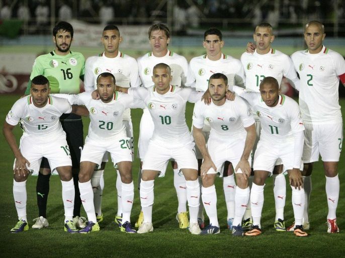 FILE - In this Nov. 19, 2013 file photo, Algeria national soccer team poses prior to the start the World Cup qualifying soccer match between Burkina Faso and Algeria in Blida, Algeria. Background from left: Mohamed Lamine Zemmamouche, Faouzi Ghoulam, Mehdi Mostefa-sbaa, Carl Medjani, Islam Slimani and Madjid Bougherra. Foreground from left: El Arbi Hillel Soudani, Nacereddine Khoualed, Sofiane Feghouli, Medhi Lacen, Yacine Brahimi. ( AP Photo/ Anis Belghoul, File) - SEE FURTHER WORLD CUP CONTENT AT APIMAGES.COM