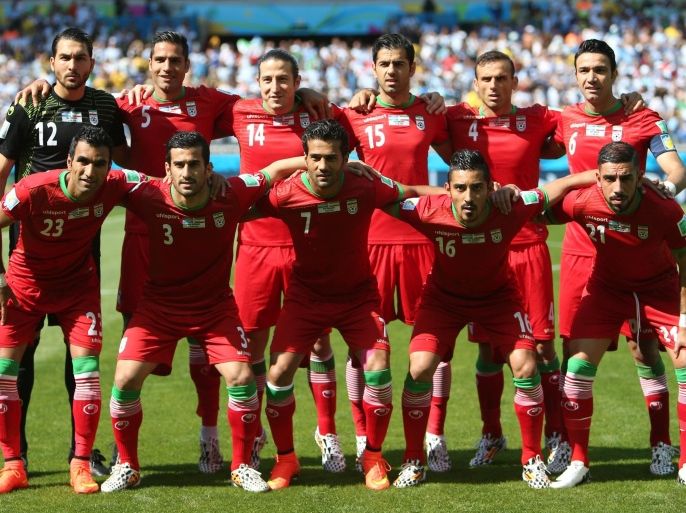 Members of Iran's national team (Back row L-R) Iran's goalkeeper Alireza Haqiqi, Iran's defender Amir Hossein Sadeqi, Iran's midfielder Andranik Teymourian, Iran's defender Pejman Montazeri, Iran's defender Jalal Hosseini and Iran's midfielder and captain Javad Nekounam (Front row L-R) Iran's defender Mehrdad Pooladi, Iran's midfielder Ehsan Hajsafi, Iran's forward Masoud Shojaei, Iran's forward Reza Ghoochannejhad and Iran's forward Ashkan Dejagah pose for the team photo prior to the Group F football match between Argentina and Iran at the Mineirao Stadium in Belo Horizonte during the 2014 FIFA World Cup in Brazil on June 21, 2014. AFP PHOTO / BEHROUZ MEHRI