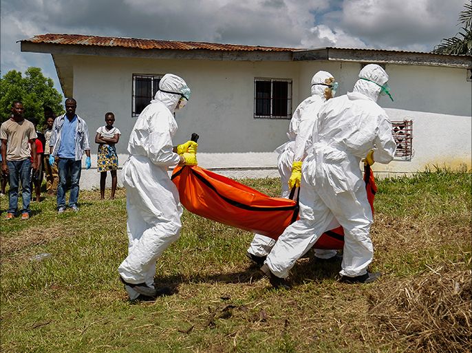 epa04462245 A Liberian Red Cross burial team retrieves the body of a suspected victim of Ebola in Banjor, on the outskirts of Monrovia, Liberia 24 October 2014. Latest statistics from the United Nations World Health Organization (WHO) place the death toll from the Ebola virus outbreak at over 4,900, with most of those fatalities in West Africa. The African Union was planning to send more experts to Ebola-affected countries in addition to 36 medical staff already deployed, the World Food Programme WFP regional body's chair Nkosazana Dlamini Zuma said 24 October after a one-day visit to Liberia. EPA