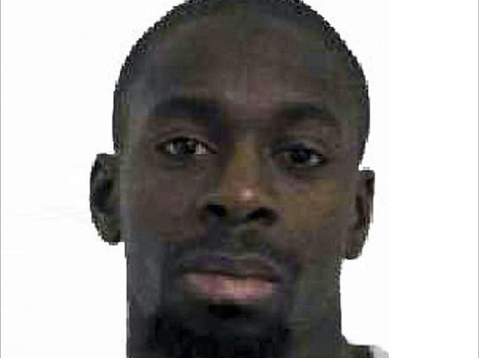 Amedy Coulibaly, aged 32, (L) who is wanted in connection with the shooting of a French policewoman yesterday and suspected as being involved in the ongoing hostage situation at a Kosher store in the Porte de Vincennes area of Paris