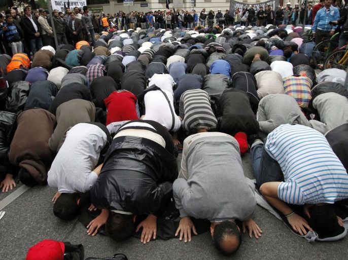 Activists of Islamic groups protest and pray against an anti-Muslim film near the U.S. embassy in Vienna, Austria, Saturday, Sept. 22, 2012.