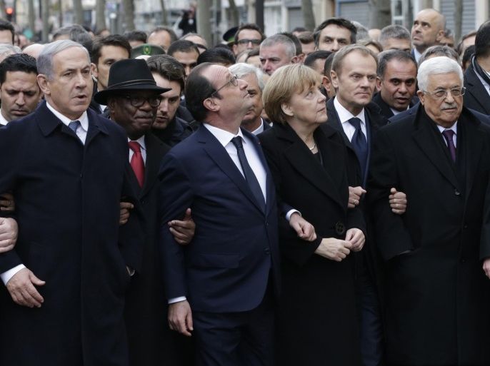 From the left, Israeli Prime Minister Benjamin Netanyahu, Malian President Ibrahim Boubacar Keita, French President Francois Hollande, German Chancellor Angela Merkel, EU president Donald Tusk and Palestinian Authority President Mahmoud Abbas march during a rally in Paris, France, Sunday, Jan. 11, 2015. A rally of defiance and sorrow, protected by an unparalleled level of security, on Sunday will honor the 17 victims of three days of bloodshed in Paris that left France on alert for more violence. (AP Photo/Philippe Wojazer, Pool)