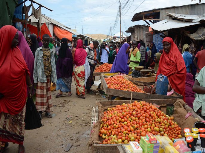 Vendors sell fresh goods at the Karan market, in Somalia's capital of Mogadishu on June 30, 2014 after a bomb exploded. Two people were killed and seven wounded when a bomb exploded on June 30 in a busy market in Somalia's capital Mogadishu at the start of Islam's holy month of Ramadan, police said. There was no immediate claim of responsibility, but Somalia's Al-Qaeda linked Shebab have carried out a string of similar bombings, and have vowed to increase attacks during the fasting month of Ramadan. AFP PHOTO/MOHAMED ABDIWAHAB