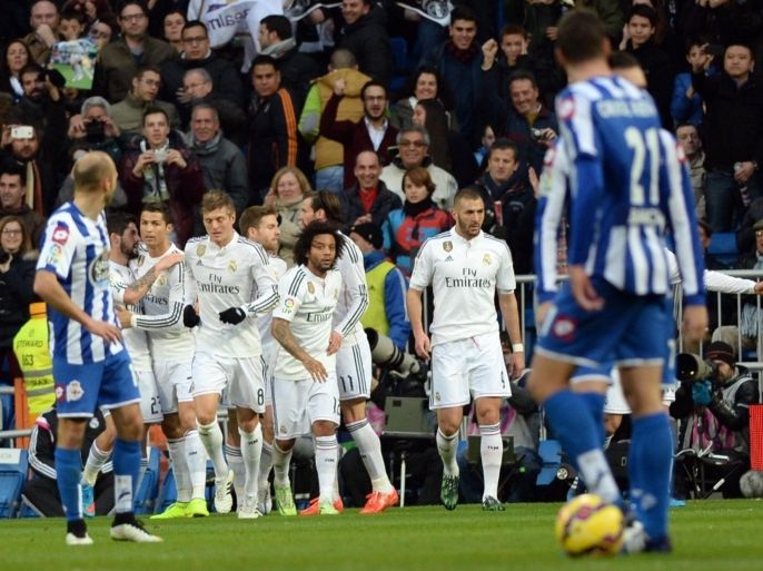 MADRID, SPAIN - FEBRUARY 14: Players of Real Madrid celebrate after scoring during the La Liga match between Real Madrid CF and RC Deportivo La Coruna at Estadio Santiago Bernabeu on February 14, 2015 in Madrid, Spain.