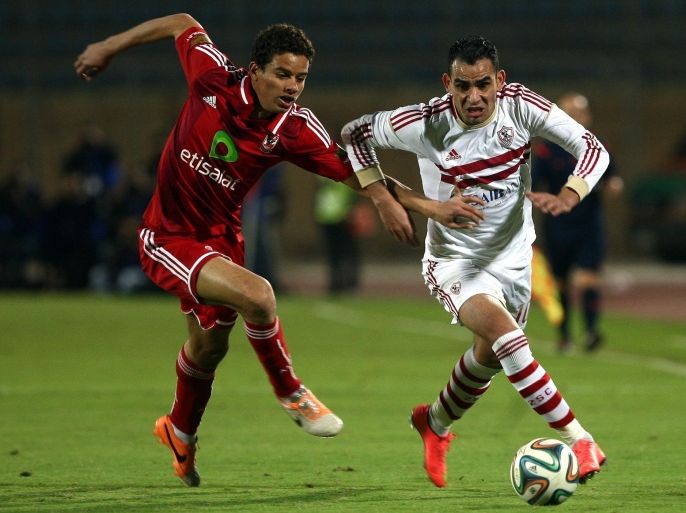 Al-Zamalek player Ahmed Eid (R) fights for the ball with Al-Ahly player Saad Samir (L) during their Egyptian Premier League soccer match in Cairo, Egypt, 29 January 2015.