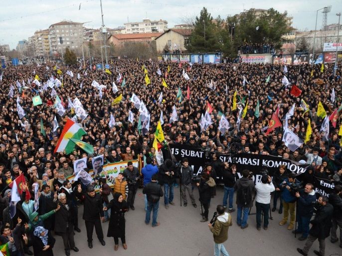 Members of the Kurdish community take part in a protest calling for the release of convicted Kurdistan Worker's Party (PKK) leader Abdullah Ocalan in Ankara on February 15, 2015. Ocalan was captured by Turkish undercover agents in Kenya in 1999, brought back to Turkey and sentenced to death. His sentence was later commuted to life. AFP PHOTO / ILYAS AKENGIN