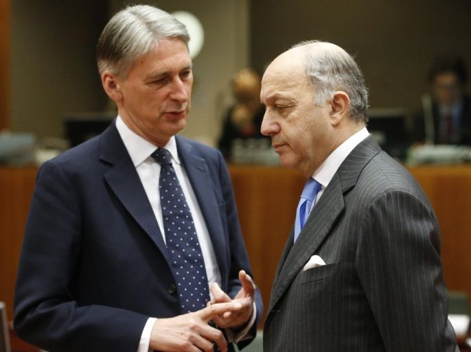 British Foreign Secretary Philip Hammond chats with French Foreign Affairs Minister Laurent Fabius at the start of the European Foreign Affairs Council, in Brussels, Belgium, 09 February 2015.