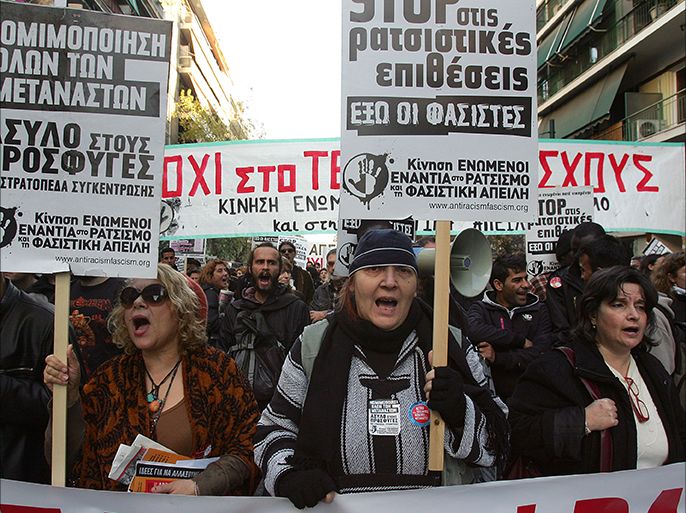 epa02531016 Immigrants shout slogans during an anti-racism rally being in Athens organized by labor, student and immigrant unions, on 15 January 2011