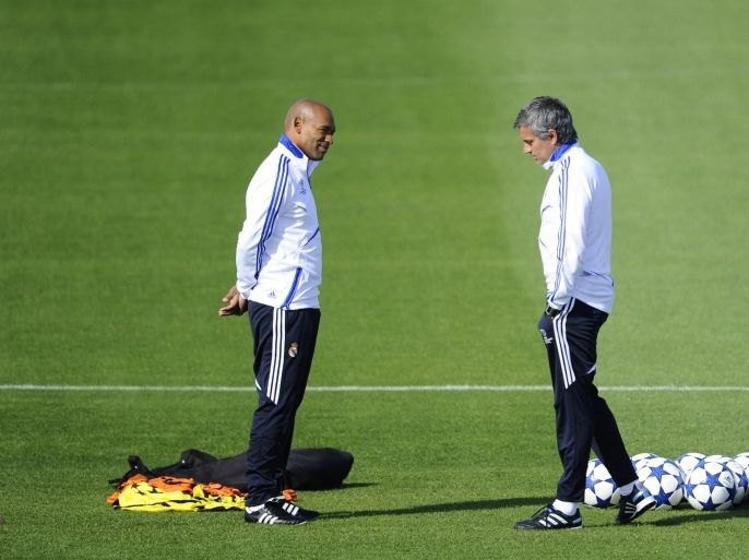 Real Madrid's Portuguese coach Jose Mourinho (R) and his assistant Jose Morais (L) attend a training session in Madrid on September 27, 2010 on the eve of their Champions League football match against Auxerre.