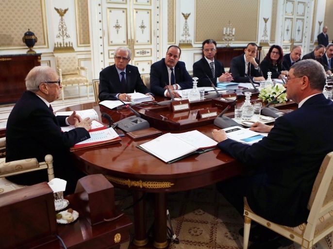 Tunisian President Beji Caid Essebsi (L) addresses the High Council of Ministers at the Carthage Palace, in Tunis, Tunisia, 18 February 2015. According to reports four members of the Tunisian police forces were killed late 17 February when 20 gunmen from the al-Qaeda affiliated Phalange Okba Ibn Nafaa group attacked a checkpoint near the Algerian border, stealing their weapons in the fray.