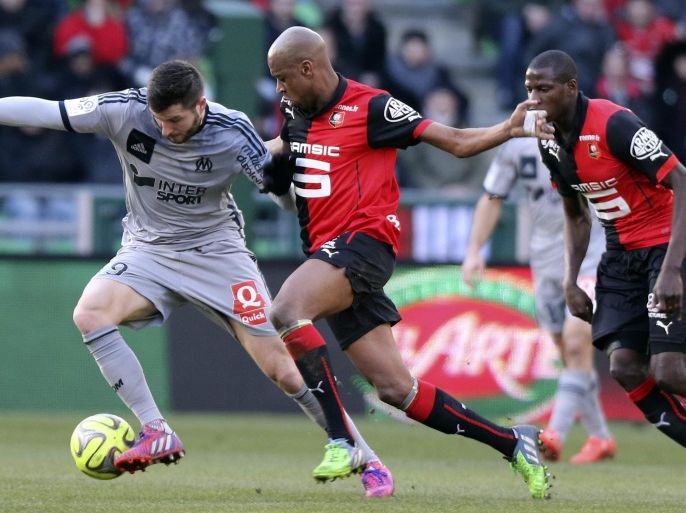 Andre Pierre Gignac of Olympic Marseille vies for the ball with Gelson Fernandes of Rennes during the French Ligue 1 soccer match between Stade Rennais FC and Olympic Marseille OM at the Route de Lorient stadium in Rennes, France, 07 February 2015.