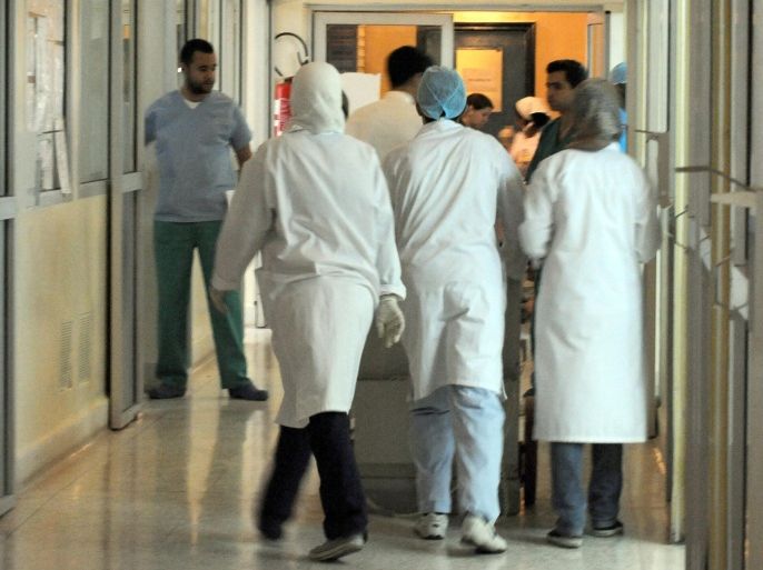 Nurses and doctors walk in a corridor of the intensive care service of the Ibn Toufail hospital, where people wounded in the bomb attack at the Argana cafe have been admitted, on April 29, 2011. At least six French citizens were among those killed in a bomb attack on a tourist cafe in Morocco and 10 more were wounded, a French government source told AFP on Friday. Earlier, Moroccan authorities had said that in all 16 people were killed in Thursday's blast, which ripped through the crowded eatery on the Jamaa el-Fna, a popular square in the historic city of Marrakesh.