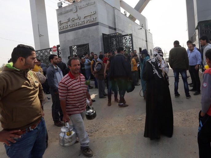 Palestinians wait to cross the border between the Gaza Strip and Egypt, at the Rafah border crossing, in the southern Gaza Strip, 10 March 2015. Media reports stated that people were gathering at the crossing after Egypt opened the border on 09 March 2015 for the first time since January. Egypt had been closing its borders with the Gaza Strip since a deadly attack in Sinai in late October 2014 in which 30 Egyptian soldiers were killed.