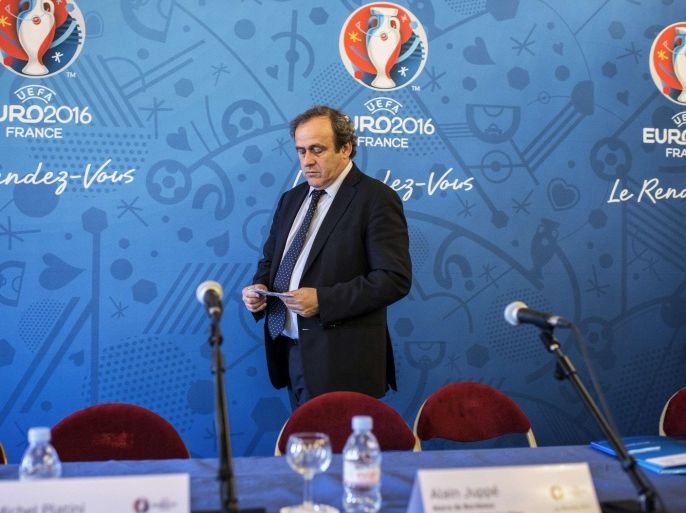 UEFA President Michel Platini arrives for the press conference, on March 12, 2015 in Lyon, during the 7th steering committee for the Euro 2016. AFP PHOTO / JEFF PACHOUD