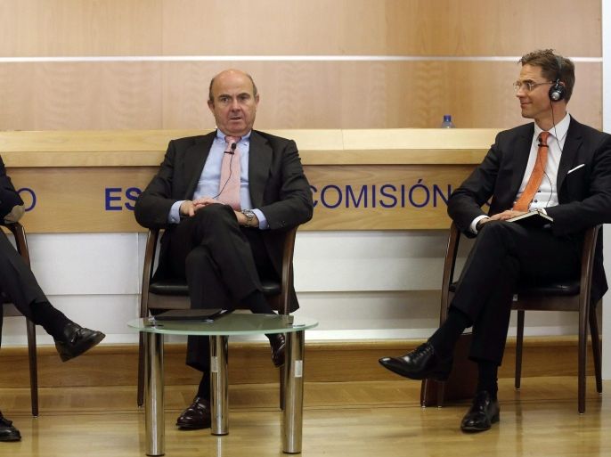 European Commission Vice-President, responsible for Economic and Monetary Affairs and the Euro, Jyrki Katainen (R), member of the European Parliament for the European People's Party, Pablo Zalba (L) and Spanish Economy minister Luis de Guindos (R) during a student debate held in Madrid, Spain on 27 February 2015.