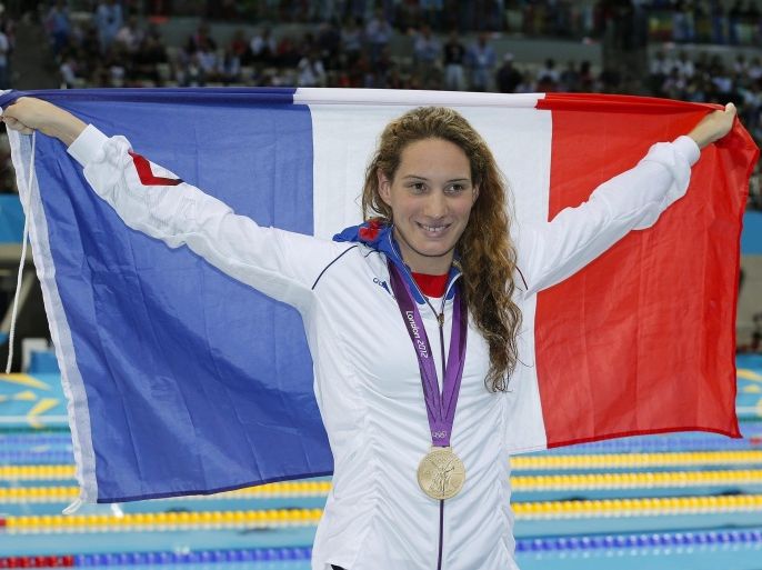 (FILE) A file picture dated 29 July 2012 shows Camille Muffat of France celebrates winning the gold medal in the women's 400m Freestyle Final during the Swimming competition held at the Aquatics Center during the London 2012 Olympic Games in London, Britain. Ten people including several French athletes were killed on 09 March 2015 when two helicopters collided in northern Argentina, news reports said. The dead included both Argentine pilots and the cast and crew of a reality television survival show, which was to feature a celebrity cast including Olympic swimmer Camille Muffat, former boxer Alexis Vastine and yachtswoman Florence Arthaud, according to La Nacion newspaper. The aircrafts came down just after taking off in La Rioja, around 1,000 kilometres west of Buenos Aires in the foothills of the Andes.